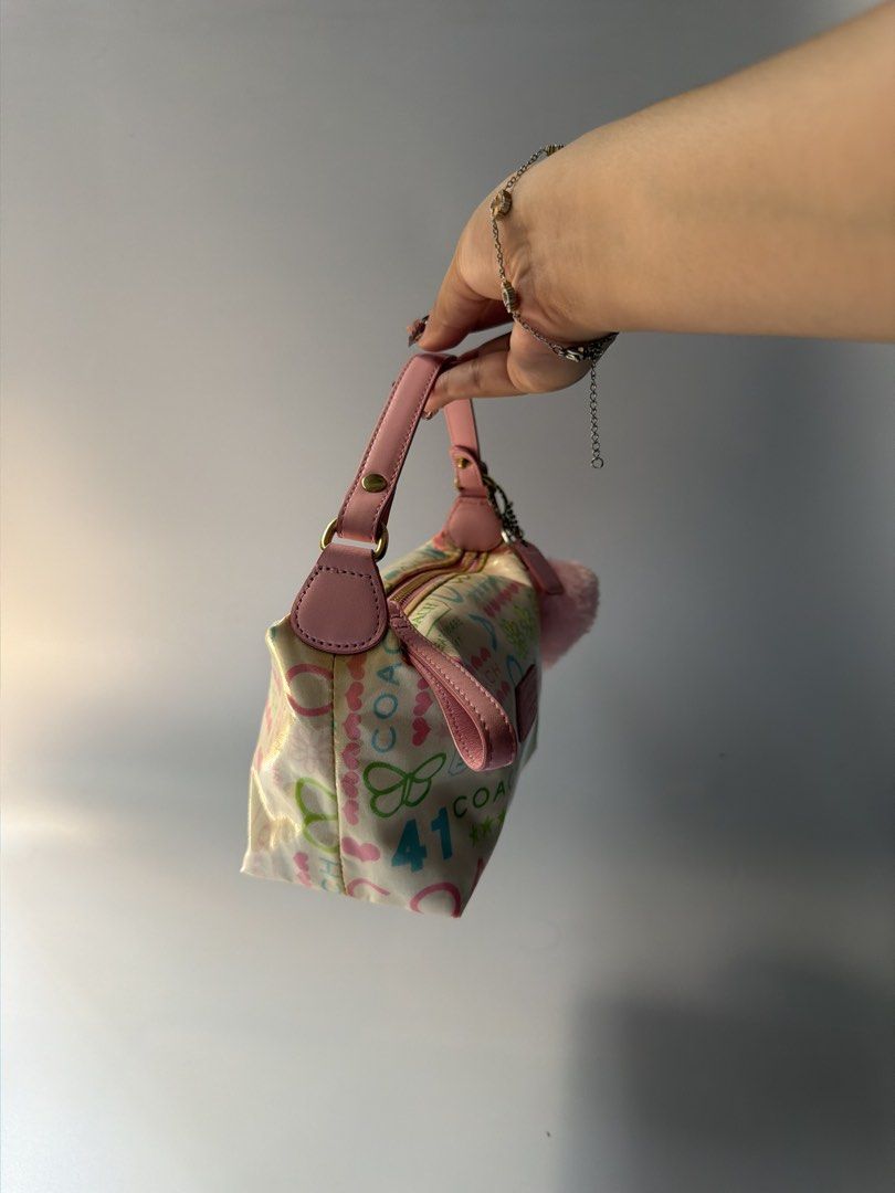 (RESERVED VIA LA) Y2K Coach Multicolor Graffiti Mini Bag (Category: Shoulder Bags) located in Mandaluyong City. Submitted by n444m (Listing ID 1463612159, Image 3). Description: Y2K Coach Multicolor Graffiti Mini Bag -still negotiable -w free charm.