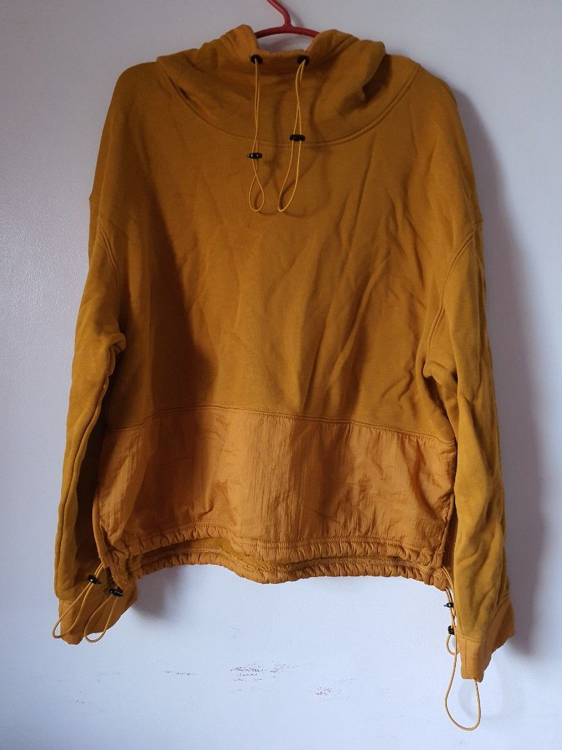 Yellow Drawstring Hoodie with Contrast Panel (Category: Hoodies) located in Meycauayan. Submitted by shoptoown (Listing ID 1463579665, Image 1). Description: - Bright yellow hoodie - Contrasting fabric panel at the bottom - Features a drawstring hood - Adjustable hem for a customized fit - Ideal for everyday casual wear.