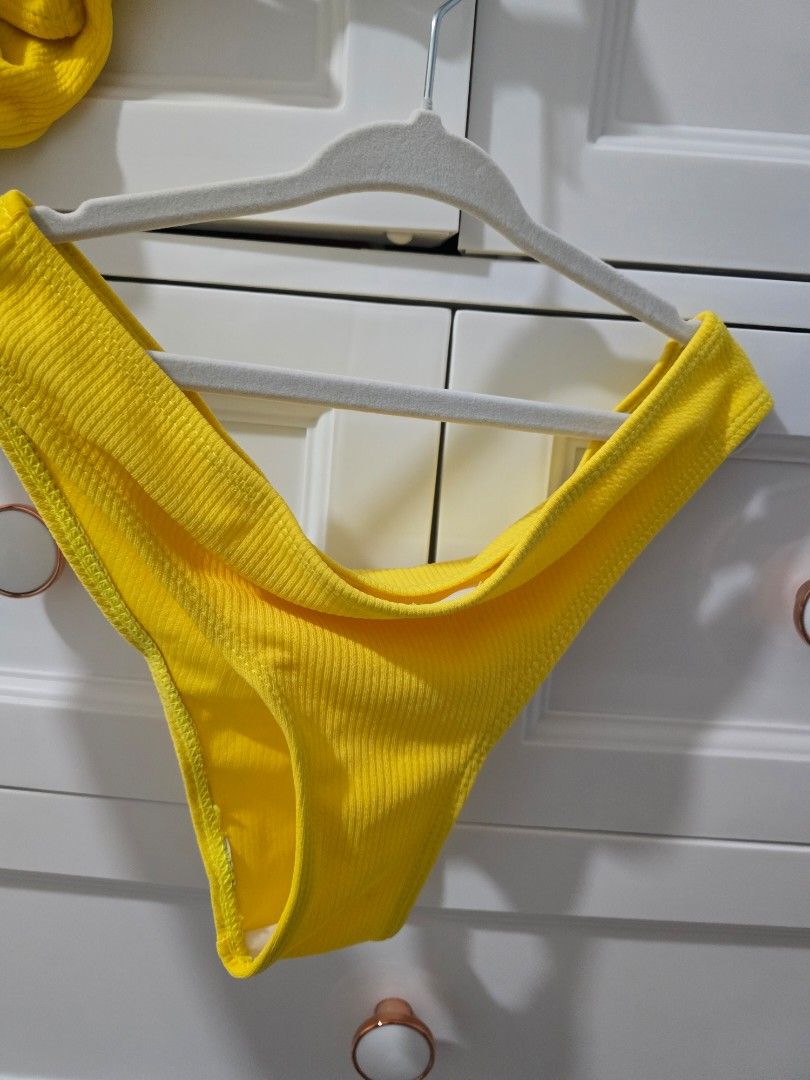 Yellow Textured Bikini Top (Category: Bikinis & Swimsuits) located in Arayat. Submitted by polenbi15 (Listing ID 1463582332, Image 2). Description: - Bright yellow bikini top - Textured fabric - Strappy design - Ideal for beach or pool - Ready for your next vacation!.