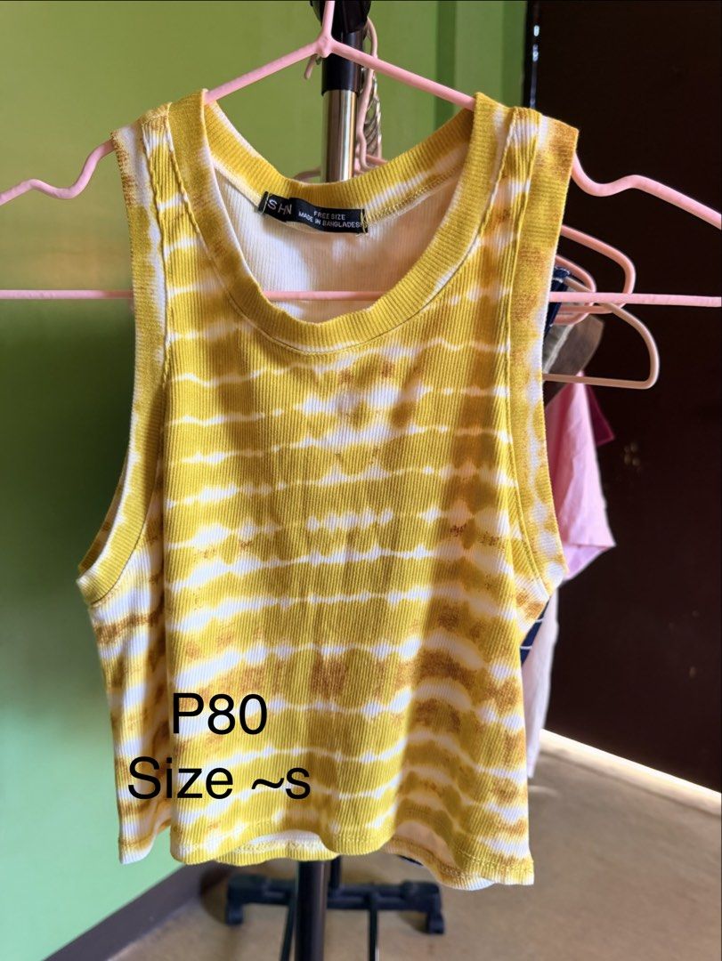 Yellow Tie-Dye Ribbed Tank Top (Category: Sleeveless) located in Muntinlupa City. Submitted by cocofinds023 (Listing ID 1463711088, Image 1). Description: - Adorable yellow and white tie-dye pattern - Comfortable ribbed material - Estimated size: Small - Versatile for casual outfits or layering.