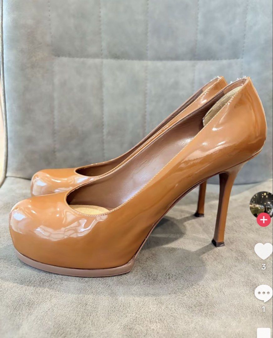 Yves Saint Laurent Patent Leather Platform Heels (Category: Heels) located in Caloocan City. Submitted by geemariell56161 (Listing ID 1463711608, Image 2). Description: - Classic YSL patent leather heels - Beautiful caramel brown color - Features a platform sole and stiletto heel - YSL logo visible on the inside - Versatile for dressing up any outfit - A timeless addition to your shoe collection.