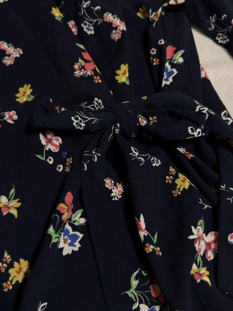 Zara Basic Navy Floral Wrap Dress with Bell Sleeves (Category: Dresses) located in Cebu City. Submitted by eynjlin (Listing ID 1463688423, Image 3). Description: - Zara Basic navy blue wrap dress - Pretty all-over floral print with colorful small flowers - Long bell sleeves - Tie waist - Slightly ruffled hemline - Perfect for casual outings or dressing up.