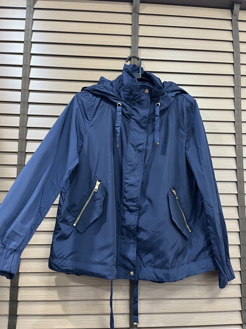 Zara Basic Outerwear Navy Blue Hooded Jacket (Category: Coats, Jackets and Outerwear) located in Mabalacat. Submitted by fashionclothesph (Listing ID 1463695740, Image 2). Description: - Navy blue Zara Basic hooded jacket - Size: Medium (M) - Lightweight material, ideal for layering - Gold zipper details on pockets and front - Adjustable drawstring at hood and hem - Pampanga Location - Addtl Shipping fee.