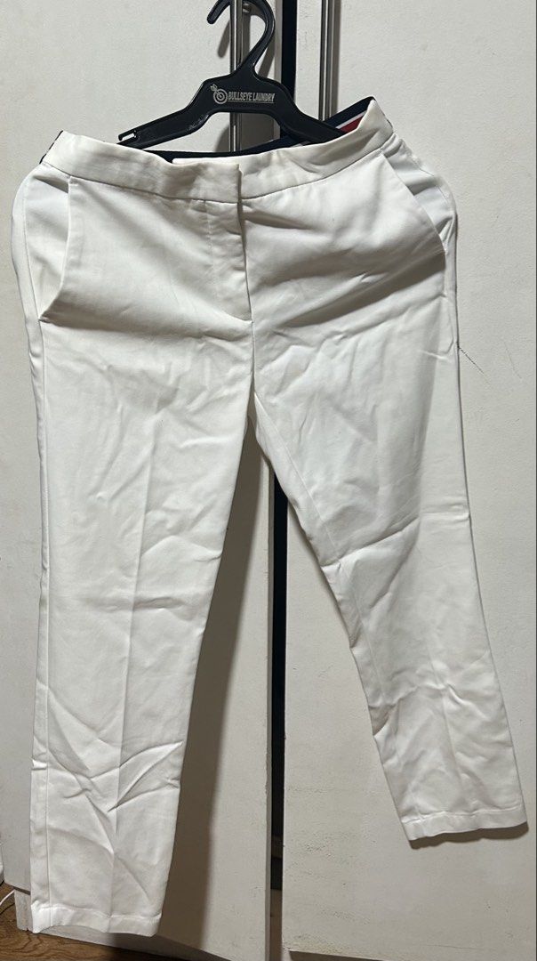 Zara Basic White Trousers (Category: Other Bottoms) located in Quezon City. Submitted by closetingz (Listing ID 1463662301, Image 1). Description: White Trousers with colored detail at the back (see photo) Fits 26 waist.