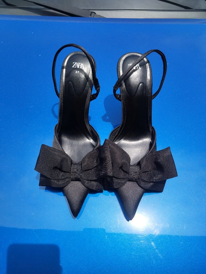 Zara Black Bow Heels Size 37 (Category: Heels) located in Candon. Submitted by bernabepradoiii (Listing ID 1463585309, Image 1). Description: - Brand: Zara - Color: Black - Size: 37 - Features: Bow detail at the front, ankle strap closure, pointed toe - Style: Dressy, perfect for elevating any outfit.