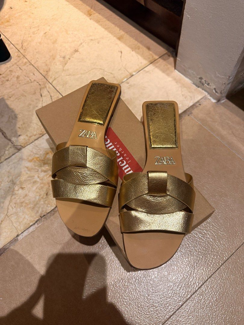 Zara Gold Flat Sandals (Category: Flats & Sandals) located in Pasig City. Submitted by calliemanila (Listing ID 1463579147, Image 1). Description: - Zara gold flat sandals - Light tan sole - Rarely used - free shipping for orders 500 and above :) - Metro Manila, Rizal only .
