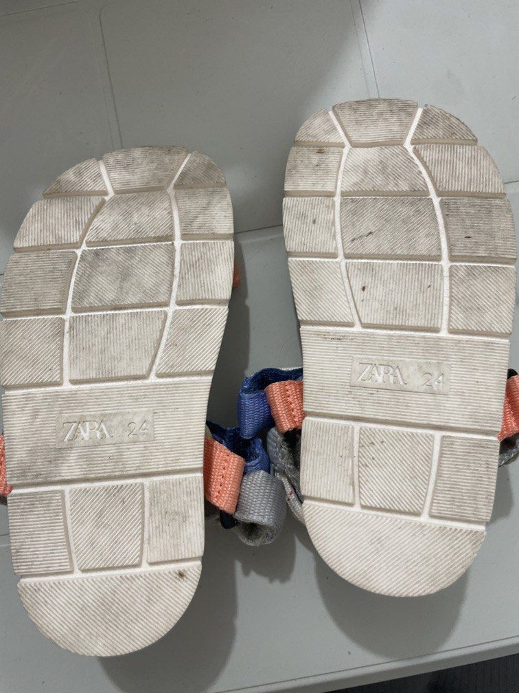 ZARA Kids Sandals Size 24 16cm (Category: Babies & Kids Fashion) located in Quezon City. Submitted by sanri23 (Listing ID 1463573643, Image 3). Description: - Cute Zara sandals - Size 24 - 16 cm - White base with colorful straps (coral, blue, yellow, grey) - Rope detailing on straps - Adjustable velcro closure - Soles show some wear, but plenty of life left - Great for everyday wear.