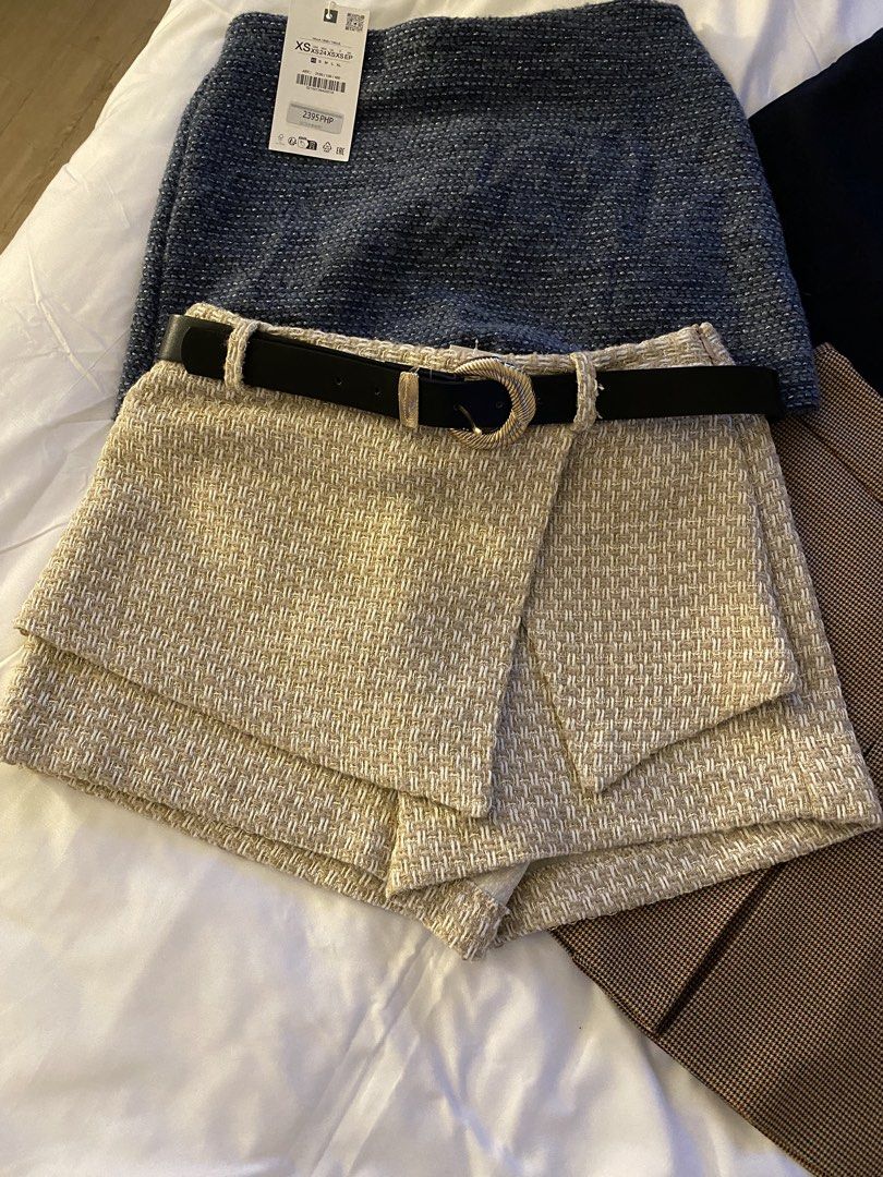 Zara Tweed Skort with Belt (Category: Skirts) located in Quezon City. Submitted by myshoppingaccount24 (Listing ID 1463628628, Image 1). Description: - Zara skort in textured tweed fabric - Beige and gold threads woven throughout - Comes with a black belt with a gold buckle - Size S - Perfect for dressing up or down - Great for any occasion.
