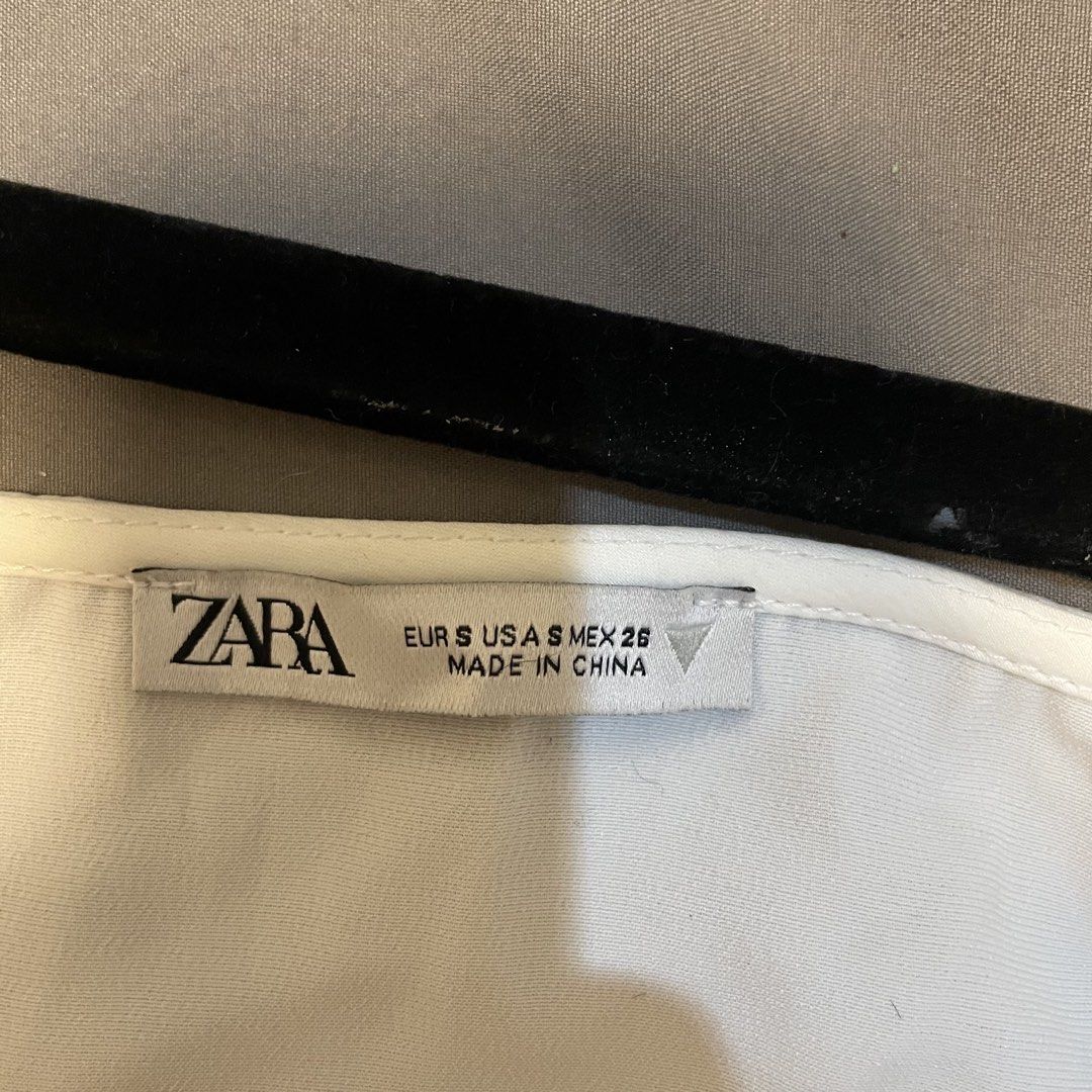 ZARA White Halter Neck Top (Category: Sleeveless) located in Quezon City. Submitted by mari0502 (Listing ID 1463666185, Image 2). Description: - ZARA White Halter Neck Top - Size: Small (S), but would better fit XS - Please note: there is a small snag on the fabric near the stitching (refer to the last photo) - Never worn out, but no tag. - RFS: too small - bought in the US.