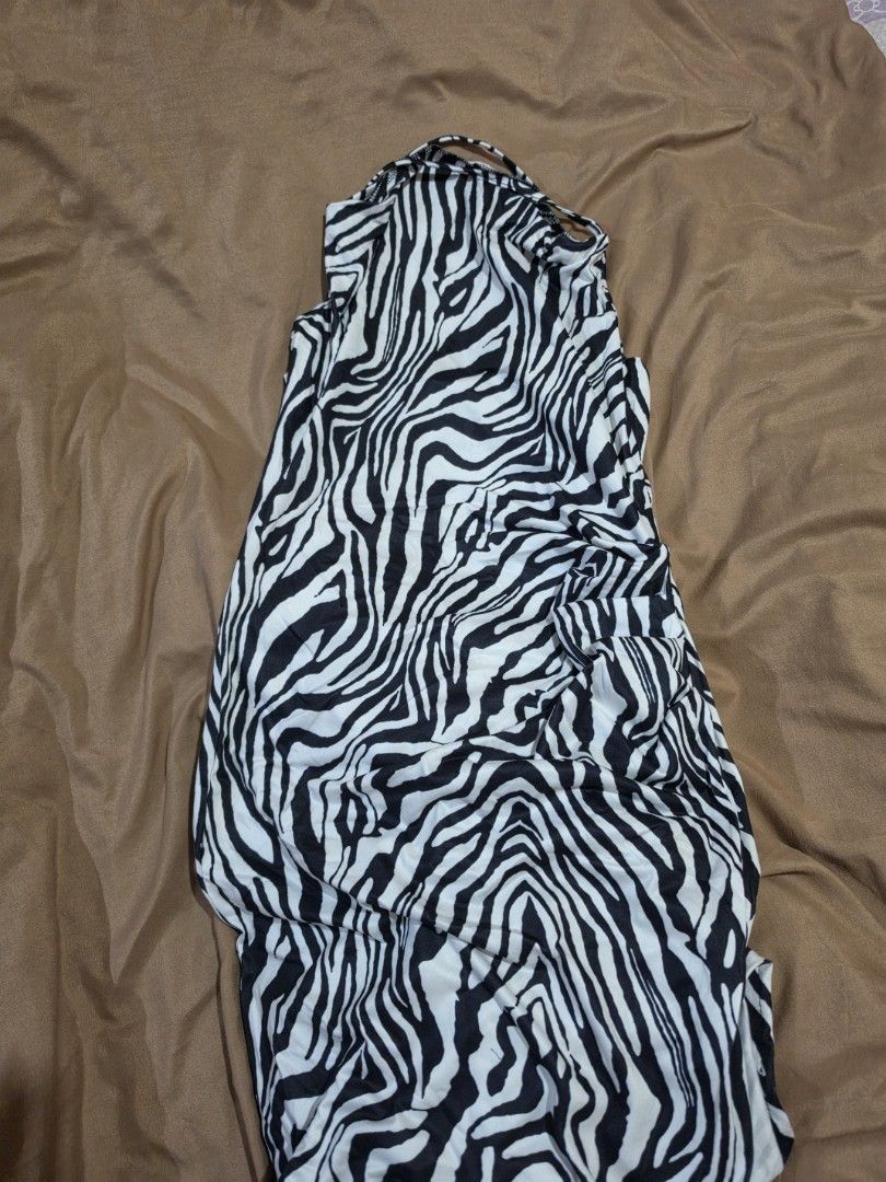 Zebra Print Halter Neck Maxi Dress (Category: Dresses) located in Malabon City. Submitted by lpzangie (Listing ID 1463704393, Image 3). Description: - zebra print - Halter neck with thin straps - Unique criss-cross back strap design - Flowy and lightweight fabric - Easy to wear and style.