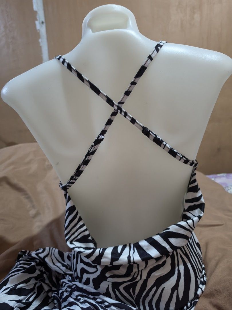 Zebra Print Halter Neck Maxi Dress (Category: Dresses) located in Malabon City. Submitted by lpzangie (Listing ID 1463704393, Image 2). Description: - zebra print - Halter neck with thin straps - Unique criss-cross back strap design - Flowy and lightweight fabric - Easy to wear and style.