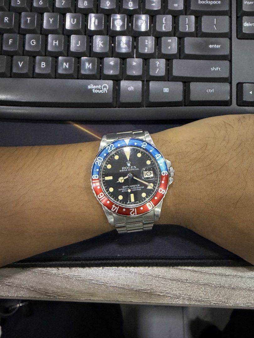 1977 Rolex GMT-Master "Pepsi" 40mm (Ref. 1675) (Category: Luxury Watches) located in Valenzuela. Submitted by macjaymill66221 (Listing ID 1463768332, Image 3). Description: 1977 Rolex GMT-Master “Pepsi” 40mm (Ref. 1675) Model/Reference: 1675 Serial Number: 5028189 (Year: 1977) Movement: Legendary Caliber 1570 Automatic (Hacking Movement, Movt# D692376) Case Back Stamp: 1675 Bezel: Original Period-Correct 1977 Fat-Font Aluminum Pepsi Insert (Bezel