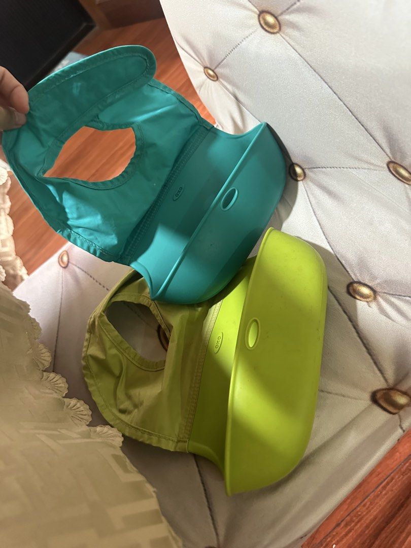 OXO Tot Silicone Bibs - Teal (Category: Weaning & Toddler Feeding) located in Davao. Submitted by mommyye (Listing ID 1463845796, Image 1). Description: - OXO Tot silicone bibs - Colors: Teal and Lime Green - Features soft fabric front - Deep pocket to catch spills - Easy to wipe clean - Ideal for feeding time.