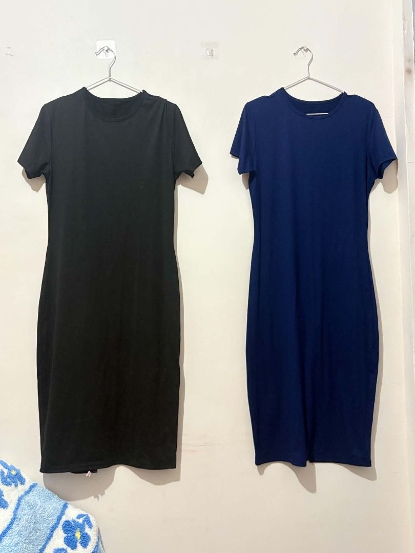 2x Basic T-shirt Dresses - Navy Blue & Black (Category: Dresses) located in San Leonardo. Submitted by burgossanleonardo.12345 (Listing ID 1463907996, Image 2). Description: - Two basic t-shirt dresses available in navy blue and black. - Features short sleeves and a knee-length cut. - Designed for ultimate comfort and a simple, relaxed style. - Versatile for everyday wear, lounging, or as a base for layering. - Effortlessly dress it up or down fo