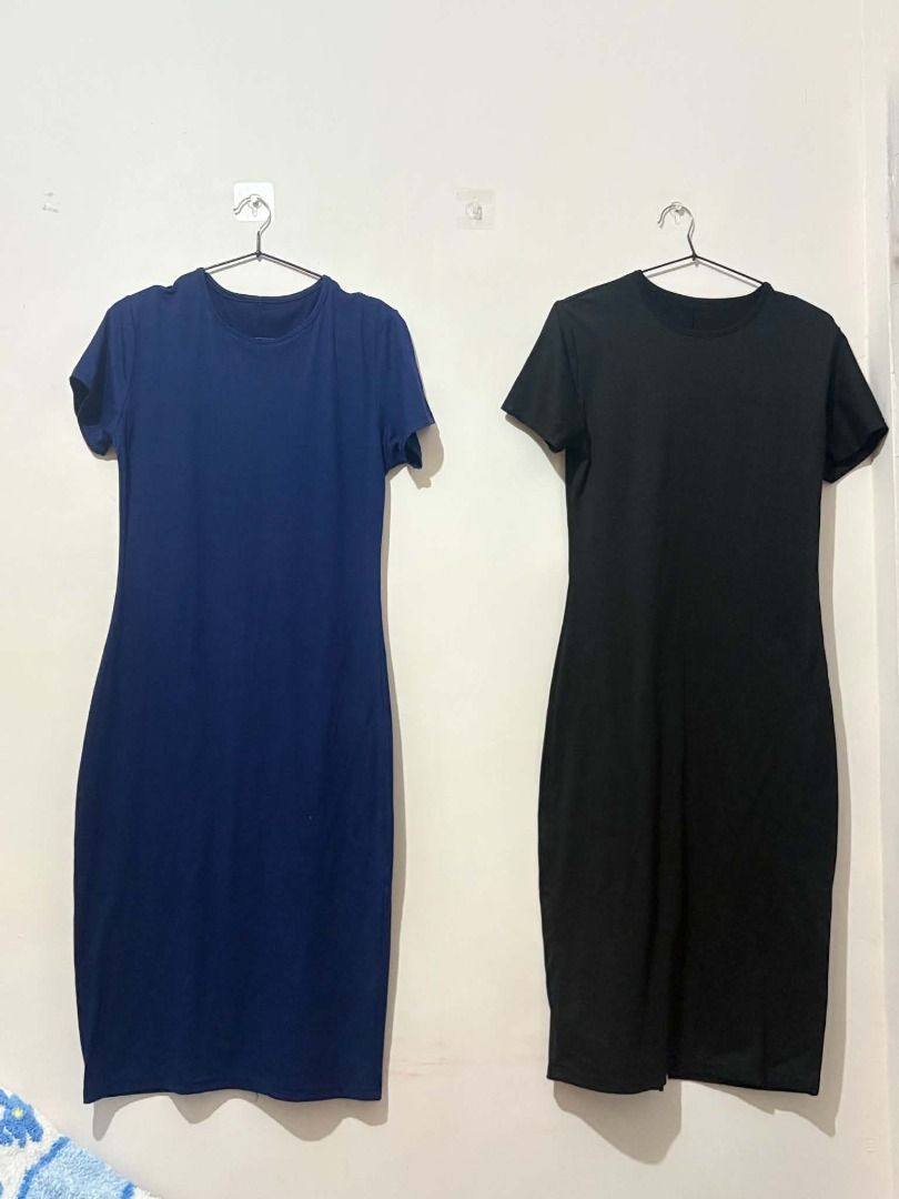 2x Basic T-shirt Dresses - Navy Blue & Black (Category: Dresses) located in San Leonardo. Submitted by burgossanleonardo.12345 (Listing ID 1463907996, Image 1). Description: - Two basic t-shirt dresses available in navy blue and black. - Features short sleeves and a knee-length cut. - Designed for ultimate comfort and a simple, relaxed style. - Versatile for everyday wear, lounging, or as a base for layering. - Effortlessly dress it up or down fo