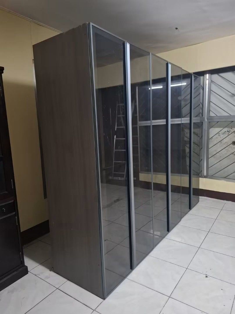 6-Door Wardrobe with Mirror Doors and Drawers (Category: Shelves, Cabinets & Racks) located in Manila. Submitted by Hezcki (Listing ID 1463749610, Image 2). Description: - Spacious 6-door wardrobe - Mirrored fronts for a stylish look - Built-in drawers for extra organization - Plenty of storage space for clothes and belongings - Attractive wood grain finish - Dimensions: Approx. 2.4m (width) x 1.8m (height) x 0.6m (depth) - Pick up only.