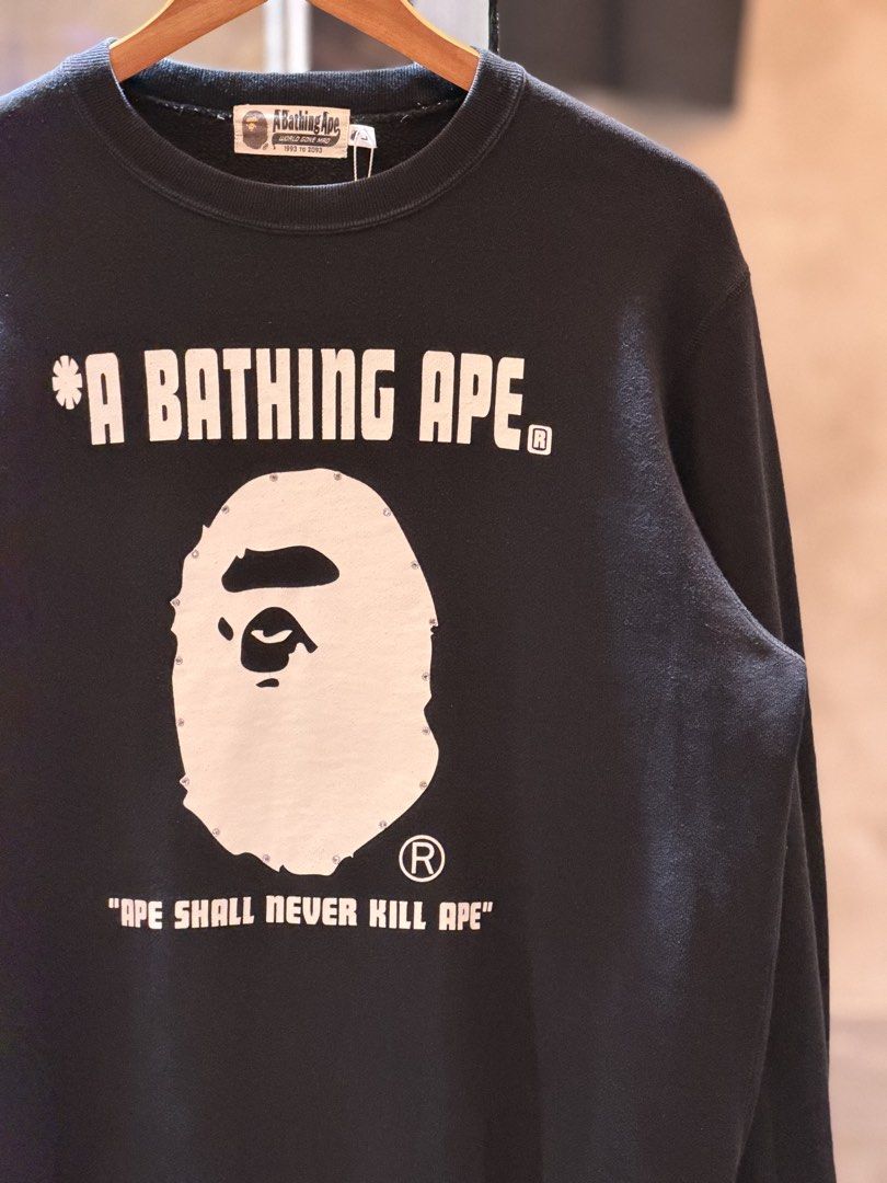 A Bathing Ape BAPE STA Crewneck Sweatshirt Black (Category: Coats, Jackets and Outerwear) located in Pasig City. Submitted by letmethrift88 (Listing ID 1463849896, Image 2). Description: - Color: Black - Brand: A Bathing Ape (BAPE) - Style: Crewneck Sweatshirt - Size: L - Features: Iconic BAPE STA logo graphic on front - Text Details: "A BATHING APE" and "APE SHALL NEVER KILL APE" - Condition: Great for any streetwear collection.