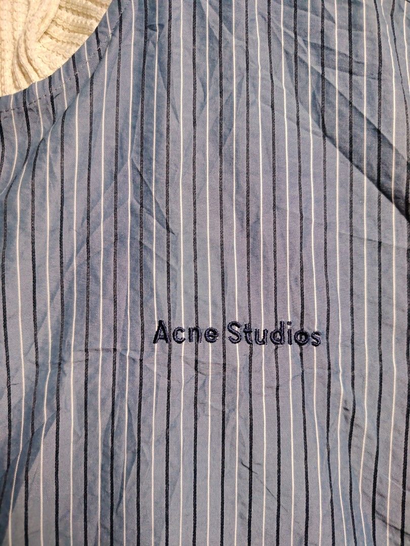 Acne Studios Striped Cropped Bomber Jacket (Category: Coats, Jackets and Outerwear) located in Baguio. Submitted by angeloshoppebaguio2600 (Listing ID 1463833180, Image 2). Description: - Acne Studios cropped bomber jacket - Blue and white pinstripe pattern - Knit collar and cuffs - Full zip front closure - Embroidered logo on chest - Made in Japan - Ideal for layering 💠ACNE STUDIO CROPTOP Length : 19.4 inches Width (Underarm) : 23.5 inches.