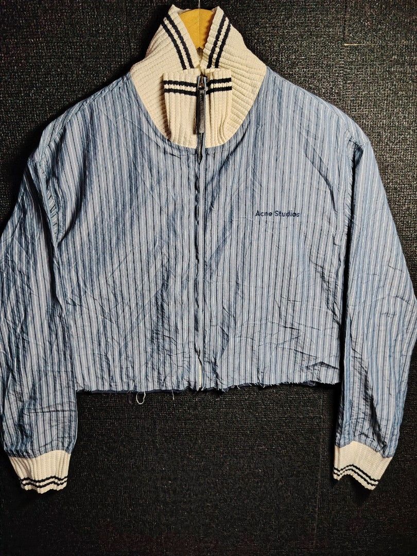 Acne Studios Striped Cropped Bomber Jacket (Category: Coats, Jackets and Outerwear) located in Baguio. Submitted by angeloshoppebaguio2600 (Listing ID 1463833180, Image 1). Description: - Acne Studios cropped bomber jacket - Blue and white pinstripe pattern - Knit collar and cuffs - Full zip front closure - Embroidered logo on chest - Made in Japan - Ideal for layering 💠ACNE STUDIO CROPTOP Length : 19.4 inches Width (Underarm) : 23.5 inches.