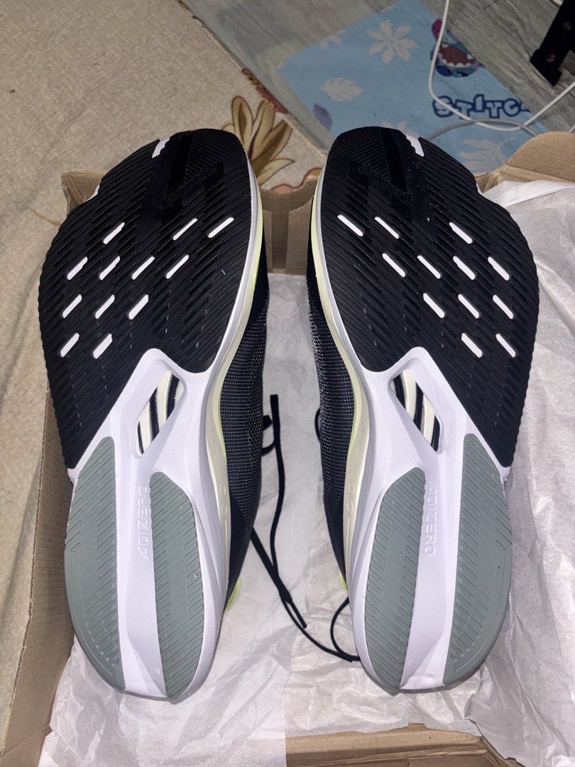 Adidas Adizero Boston 12 (Category: Sneakers) located in Paranaque City. Submitted by gingerman (Listing ID 1463935196, Image 3). Description: - Adidas Adizero Boston 12 running shoes - Color: Black with neon yellow accents - Key Features: Lightweight, designed for speed - Ideal for: Marathon runners, serious athletes - Condition: Soles look clean - Includes: Original box.