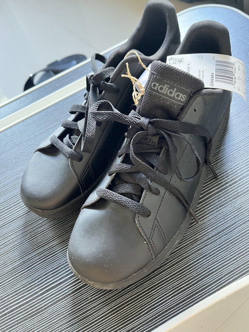 Adidas Black Sneakers (Category: Sneakers) located in Adams. Submitted by m1k3yl (Listing ID 1463818629, Image 3). Description: - Classic black Adidas sneakers - Lace-up style - Iconic Adidas branding on heel and side - Perforated details for breathability - Ideal for everyday wear - Size: 6 UK.