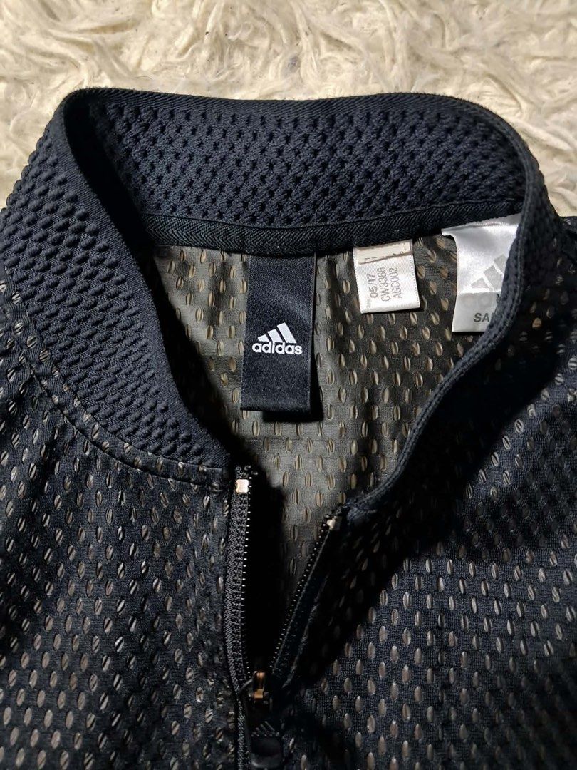 Adidas Bomber Jacket Black Mesh Size S-M (Category: Coats, Jackets and Outerwear) located in Baguio. Submitted by padisellsz (Listing ID 1463852199, Image 2). Description: - Adidas Bomber Jacket - Very good condition - Color: Black - Unique all-over mesh texture - Full zip front closure - Stand-up collar - Ribbed cuffs and hem - Ideal for layering or light outerwear - Size: S to M - May part na natanggal yung honey comb pattern. (Check pics) - Me