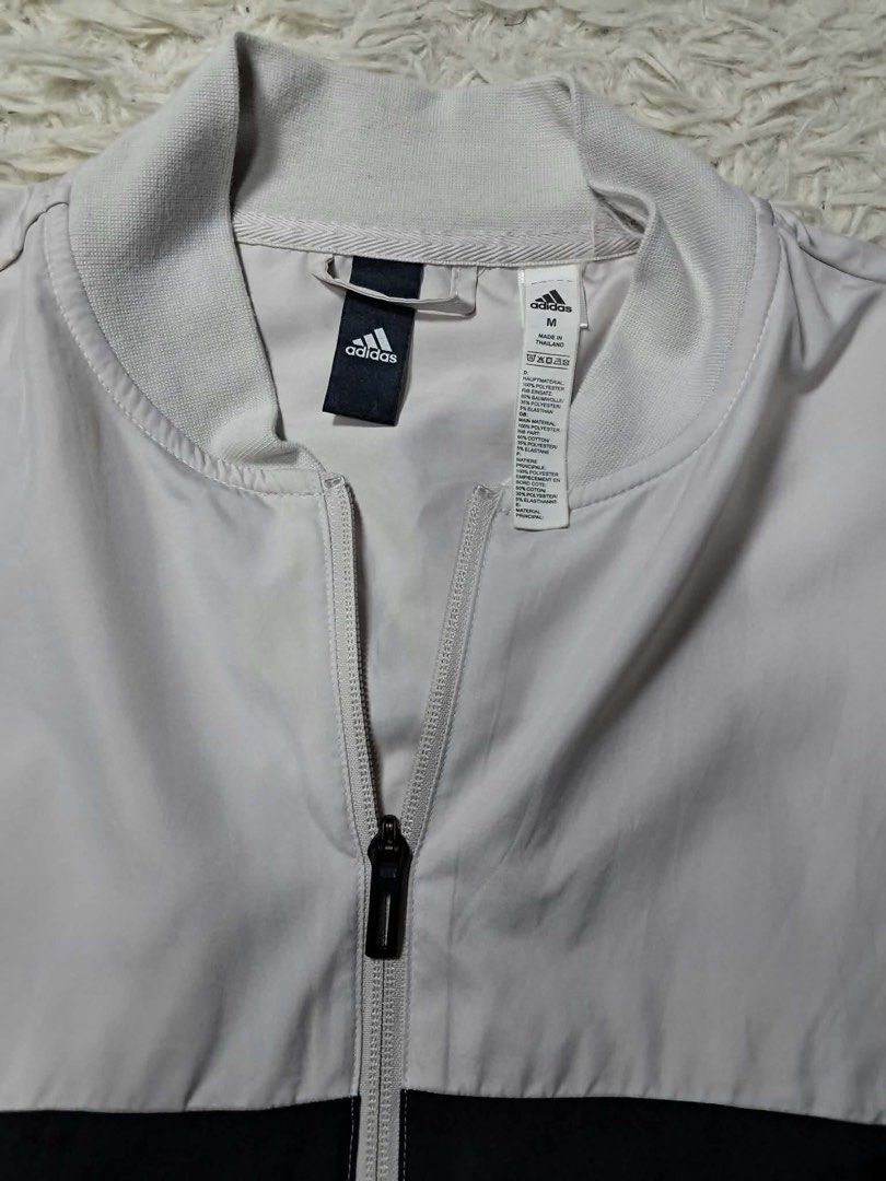 Adidas Colorblock Track Jacket Medium (Category: Coats, Jackets and Outerwear) located in Baguio. Submitted by padisellsz (Listing ID 1463862815, Image 2). Description: - Adidas colorblock track jacket - Very good condition - No issues - Color: Light grey and dark grey - Size: Medium - Features zippered pockets - Adidas logo on the sleeve - Ideal for sports or casual wear.