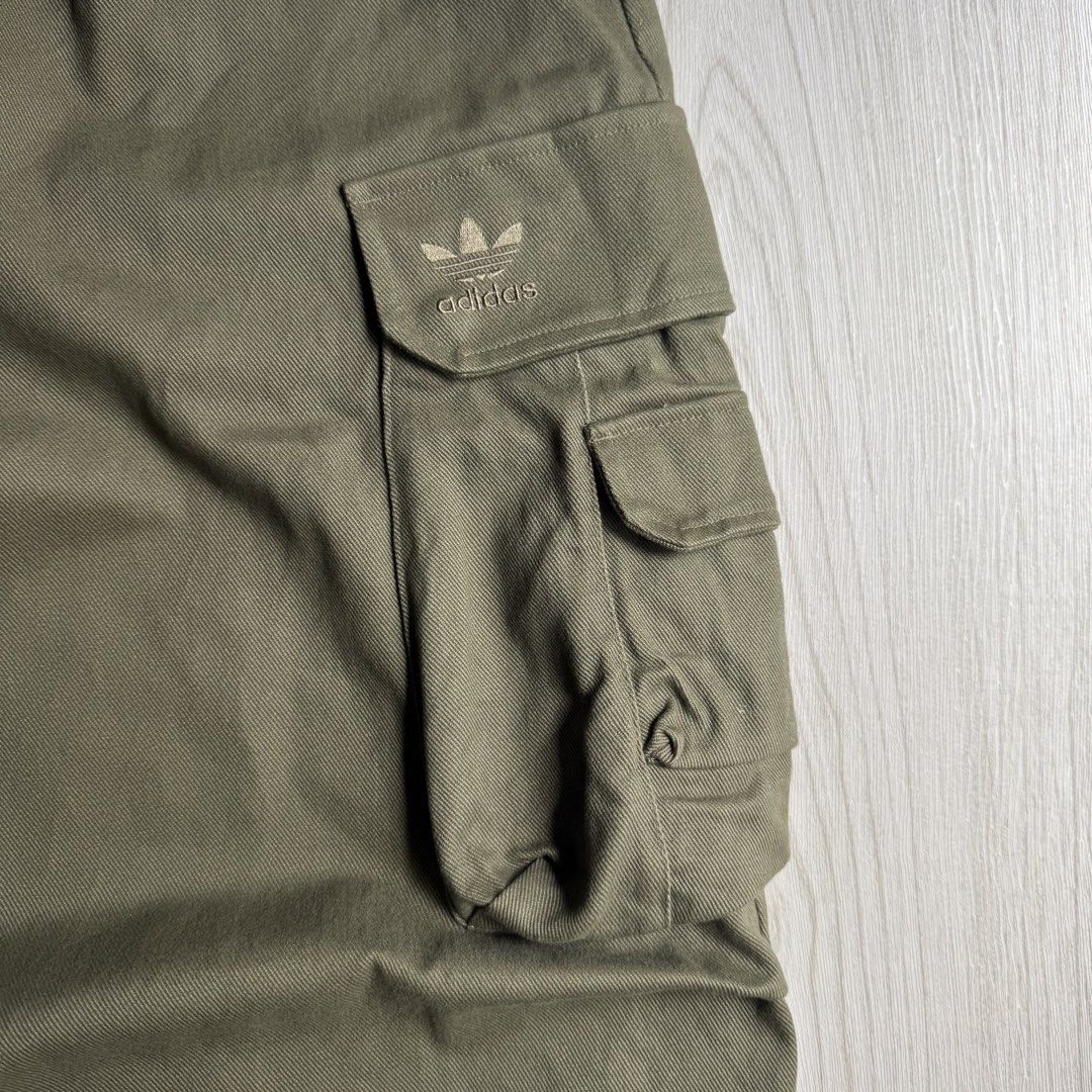 Adidas Olive Wide Cargo Pants (Category: Trousers) located in Zamboanga. Submitted by rustic.rev (Listing ID 1463778729, Image 3). Description: Adidas Olive Wide Cargo Pants Like new condition, missing drawstring. Tagged: XL fits 34-38” Measurements: Waist: 17-19” Front rise: 13.5” Thigh: 16” Leg opening: 12.5” Inseam: 28.5” Length: 42” ₱2,000 + sf.