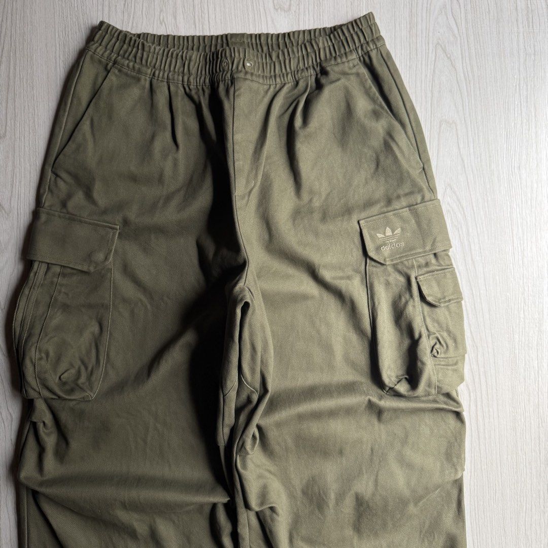 Adidas Olive Wide Cargo Pants (Category: Trousers) located in Zamboanga. Submitted by rustic.rev (Listing ID 1463778729, Image 2). Description: Adidas Olive Wide Cargo Pants Like new condition, missing drawstring. Tagged: XL fits 34-38” Measurements: Waist: 17-19” Front rise: 13.5” Thigh: 16” Leg opening: 12.5” Inseam: 28.5” Length: 42” ₱2,000 + sf.