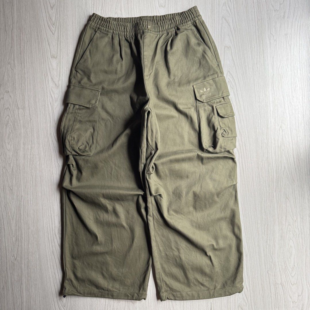 Adidas Olive Wide Cargo Pants (Category: Trousers) located in Zamboanga. Submitted by rustic.rev (Listing ID 1463778729, Image 1). Description: Adidas Olive Wide Cargo Pants Like new condition, missing drawstring. Tagged: XL fits 34-38” Measurements: Waist: 17-19” Front rise: 13.5” Thigh: 16” Leg opening: 12.5” Inseam: 28.5” Length: 42” ₱2,000 + sf.