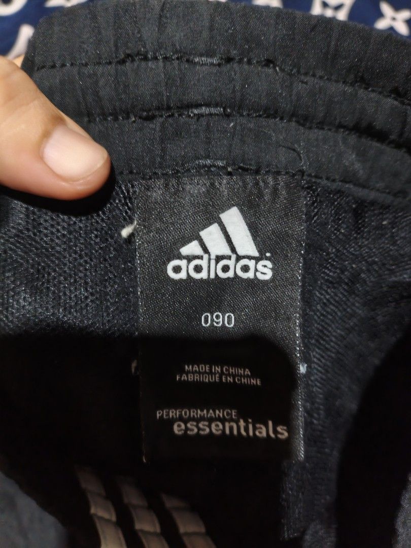 Adidas Performance Essentials Black Shorts with 3 Stripes (Category: Shorts) located in Maasim. Submitted by ukayganda25 (Listing ID 1463891484, Image 2). Description: - Classic black Adidas shorts - Features iconic three stripes on the sides - Adjustable drawstring waist for a comfortable fit - Versatile for sports or everyday casual wear - Made in China.