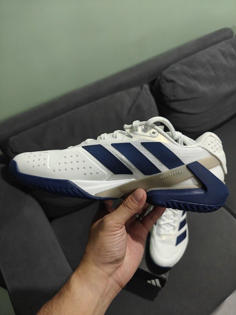 Adidas Ubersonic 5 (Category: Sneakers) located in Cebu City. Submitted by haimerslofar (Listing ID 1463911117, Image 3). Description: - Adidas white tennis shoes with blue stripes - Designed for optimal court performance - Features a secure lacing system for a snug - Provides excellent foot support - Sole offers superior grip for quick movements - Comes with the original box - Ideal for tennis and pickleball.