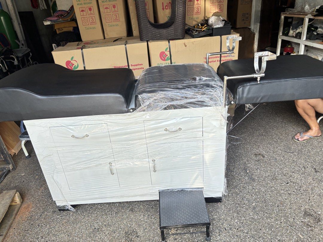 Adjustable Medical Examination Table with Storage Drawers (Category: Medical Supplies & Tools) located in Manila. Submitted by rosel2001 (Listing ID 1463768762, Image 3). Description: - Adjustable medical examination table - Black padded upholstery - White cabinet base with storage drawers - Includes a small step stool - Some protective plastic wrap still on - Ideal for clinics or home use - Ready for pickup.