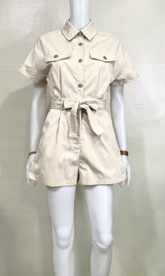 AEOM Beige Shorts Romper (Category: Rompers) located in Manila. Submitted by dcory (Listing ID 1463853047, Image 2). Description: - with side pockets - comes with beige belt (as seen in the mannequin) Measurements Bust: 34 inches Waist: 24-26 inches Length: 28 inches.