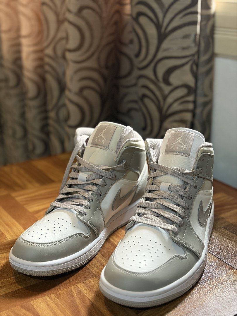 Air Jordan 1 Mid SE Light Smoke Grey (Category: Sneakers) located in Pasig City. Submitted by charlieb420 (Listing ID 1463931339, Image 2). Description: - Air Jordan 1 Mid SE in Light Smoke Grey - Classic mid-top silhouette - Perforated toe box for enhanced breathability - Stylish contrasting white and grey paneling - Subtle Nike Air branding on the tongue - Ideal for everyday casual wear.