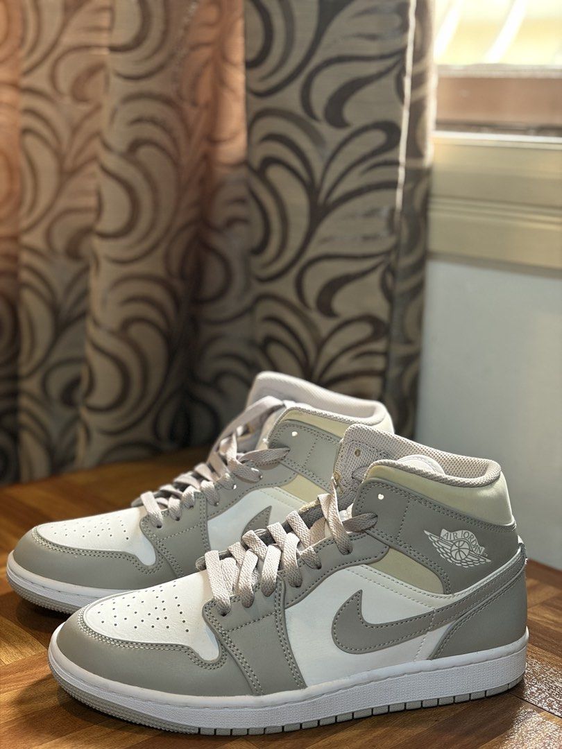 Air Jordan 1 Mid SE Light Smoke Grey (Category: Sneakers) located in Pasig City. Submitted by charlieb420 (Listing ID 1463931339, Image 3). Description: - Air Jordan 1 Mid SE in Light Smoke Grey - Classic mid-top silhouette - Perforated toe box for enhanced breathability - Stylish contrasting white and grey paneling - Subtle Nike Air branding on the tongue - Ideal for everyday casual wear.