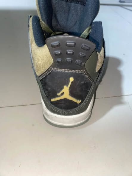 Air Jordan 4 Retro Olive Green (Category: Sneakers) located in Caloocan City. Submitted by warymclovin (Listing ID 1463874513, Image 2). Description: - selling to make a living - Authentic Air Jordan 4 Retro - Unique olive green colorway - Classic and iconic silhouette - Perfect for casual wear or collectors - Shows some signs of wear, but plenty of life left - Grab these must-have kicks!.