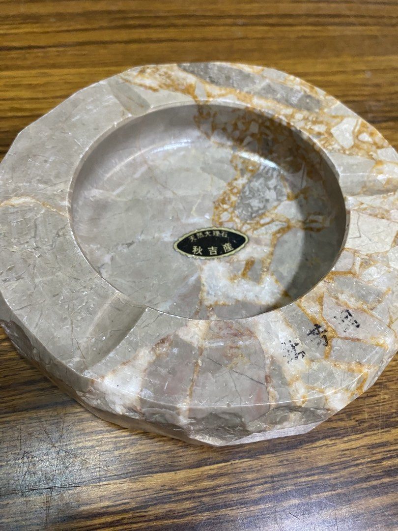 Akiyoshi Natural Stone Marble Style Ashtray (Category: Other Home Decor) located in Calamba. Submitted by chebvintagedepot (Listing ID 1463812668, Image 1). Description: [B11-01] This Akiyoshi Marble Ashtray is made from natural stone with a beige and brown pattern. The carved stone gives it a simple, natural look and makes it suitable for use as an ashtray, small catchall, or decorative piece. Dimensions: Approx. 6 inches Diameter Note: Please r