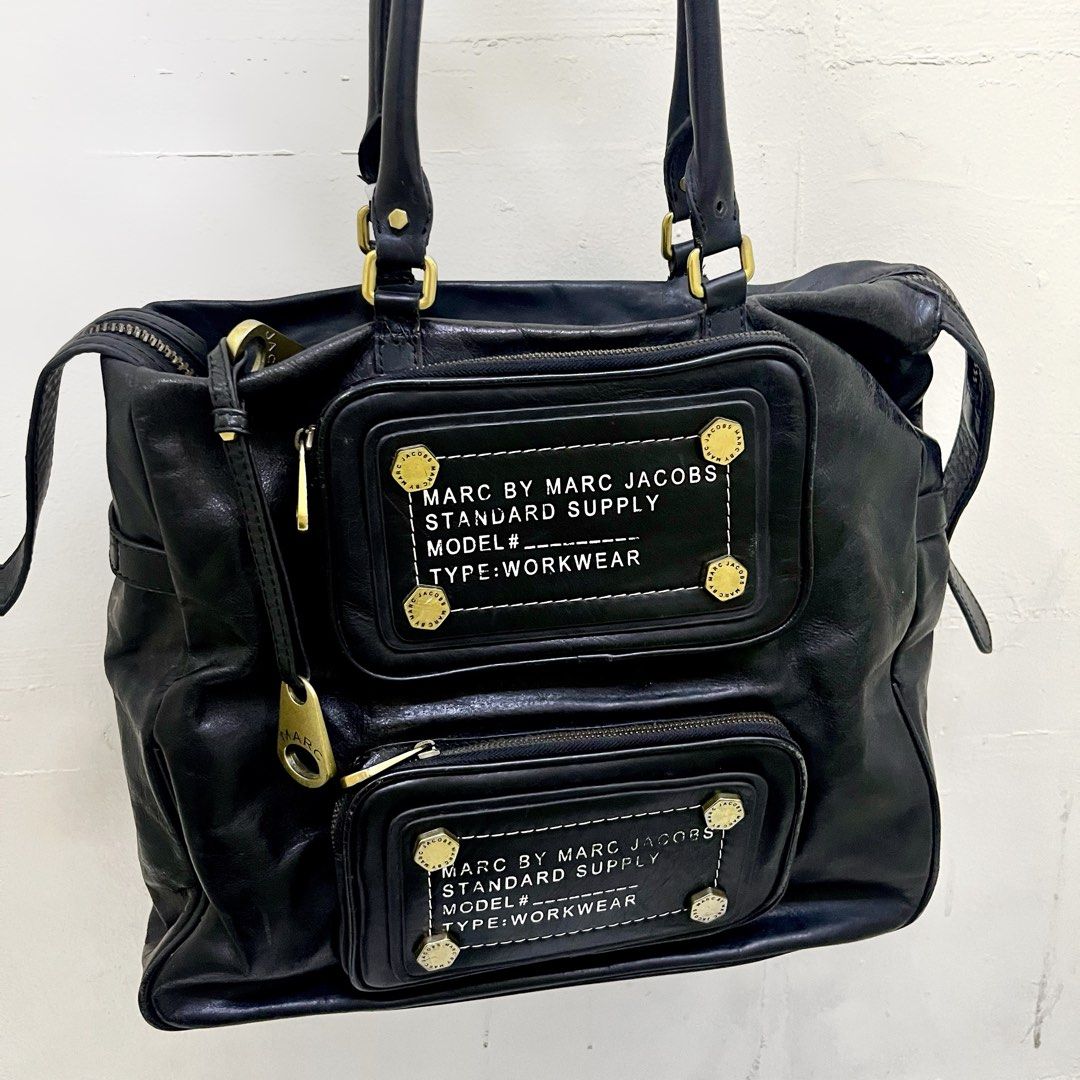 ARCHIVAL MARC BY MARC JACOBS WORKWEAR BAG (Category: Shoulder Bags) located in Manila. Submitted by ave.archives (Listing ID 1463805533, Image 1). Description: Archival Marc by Marc Jacobs piece black leather work-wear. Auth! Details: Branded marc jacob zipper pulls Multiple exterior zip compartments Medium - Large compartment Original & signature marc jacobs interior lining, complete & even stitches Condition: Good pre-loved condition. Leather h