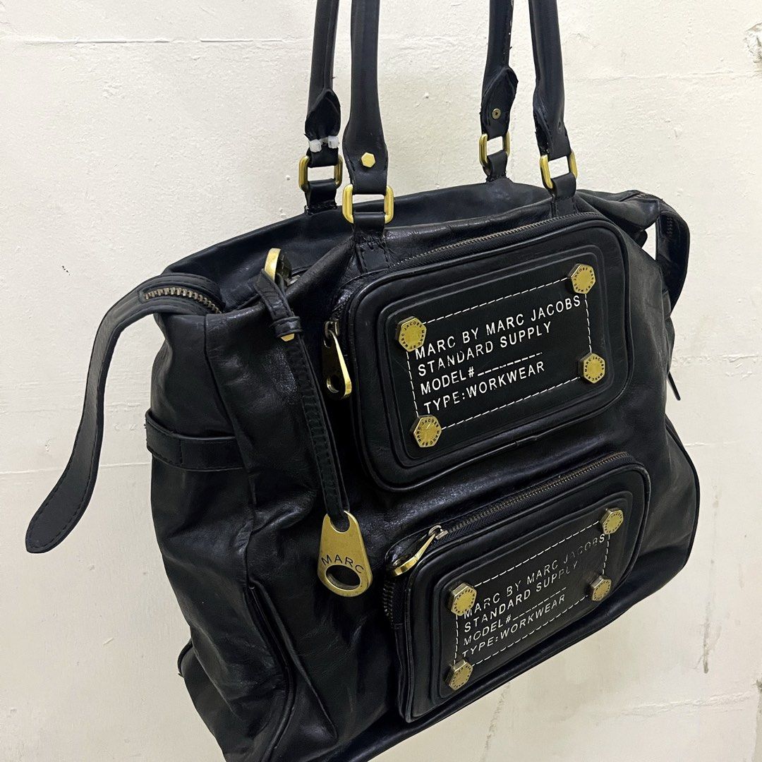 ARCHIVAL MARC BY MARC JACOBS WORKWEAR BAG (Category: Shoulder Bags) located in Manila. Submitted by ave.archives (Listing ID 1463805533, Image 3). Description: Archival Marc by Marc Jacobs piece black leather work-wear. Auth! Details: Branded marc jacob zipper pulls Multiple exterior zip compartments Medium - Large compartment Original & signature marc jacobs interior lining, complete & even stitches Condition: Good pre-loved condition. Leather h