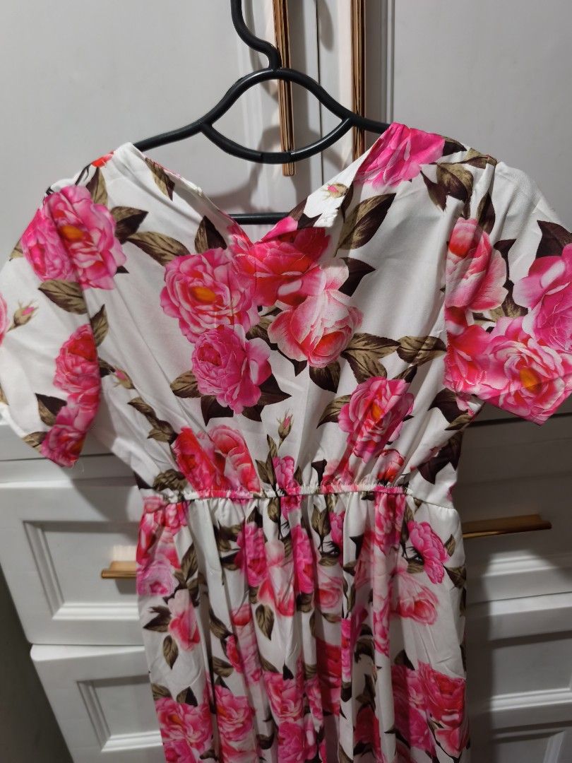 AS Elegant White Floral Dress (Category: Babies & Kids Fashion) located in Manila. Submitted by glendamae16 (Listing ID 1463783787, Image 2). Description: - Brand new with tags attached - White midi dress with vibrant pink floral print - Short sleeves - Cinched waist for a flattering silhouette - Comfortable and flowy material - Ideal for casual days or garden parties.