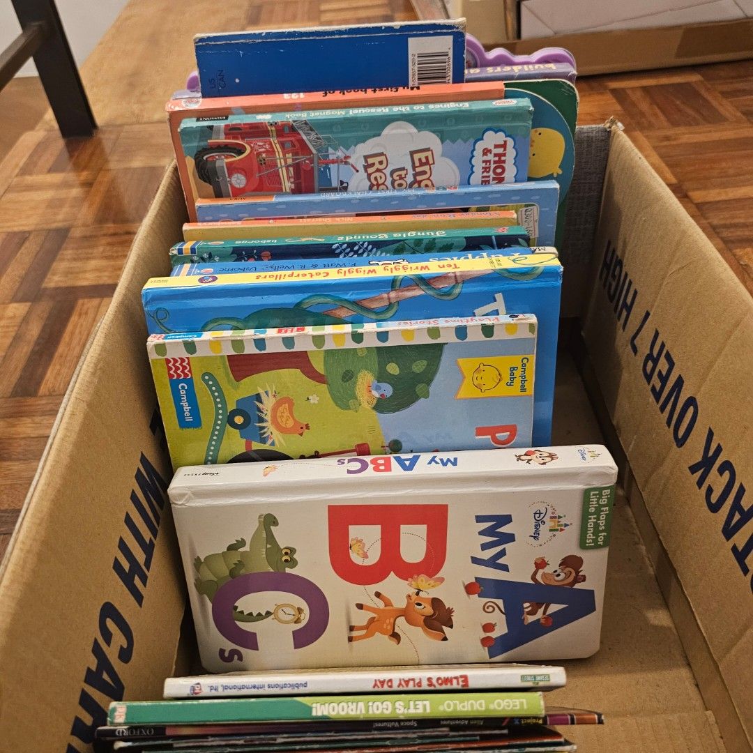 Assorted Children's Books and Wooden Puzzles Bundle (Category: Children's Books) located in Marikina City. Submitted by asbalbido (Listing ID 1463757931, Image 3). Description: - Collection of children's books included - Features books like Curious George and National Geographic Kids - Some books focus on numbers and letters - Bundle includes wooden puzzles - Puzzles have bright colors and simple designs - Ideal for toddlers and young children - 