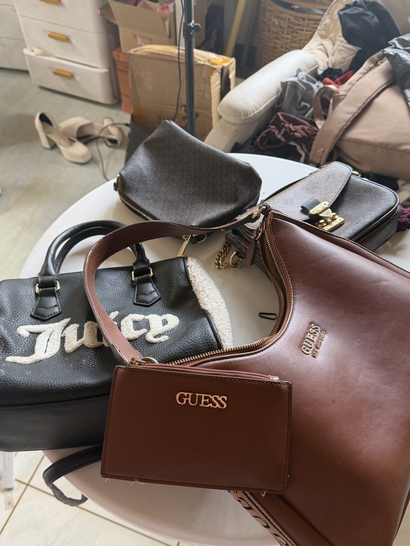 Assorted Designer Handbags - Guess, Juicy Couture (Category: Shoulder Bags) located in Santa Rosa. Submitted by ninjalei (Listing ID 1463783507, Image 2). Description: - Bundle of 4 handbags - Brown Guess shoulder bag with matching wallet - Black Juicy Couture tote with faux fur trim - Brown Louis Vuitton-style crossbody bag - Dark brown DKNY crossbody bag - Great variety for different occasions.