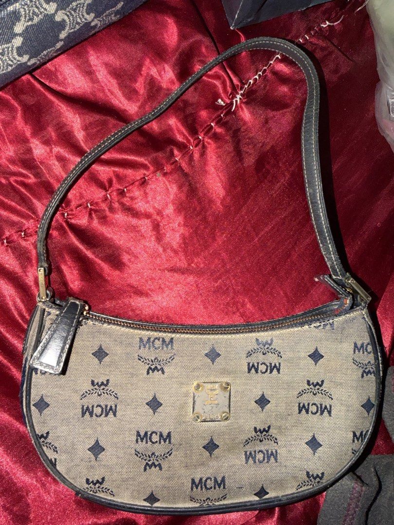 Auth MCM Monogram Shoulder Bag (Category: Luxury Bags & Wallets) located in Cavite. Submitted by declutterringggggg (Listing ID 1463836172, Image 2). Description: - Classic MCM shoulder bag - All-over monogram print - Gold-tone metal logo plate - Dark leather strap - Zipper closure - Shows some signs of wear on exterior fabric and leather trim - Great everyday bag.