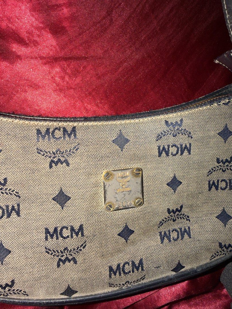 Auth MCM Monogram Shoulder Bag (Category: Luxury Bags & Wallets) located in Cavite. Submitted by declutterringggggg (Listing ID 1463836172, Image 3). Description: - Classic MCM shoulder bag - All-over monogram print - Gold-tone metal logo plate - Dark leather strap - Zipper closure - Shows some signs of wear on exterior fabric and leather trim - Great everyday bag.