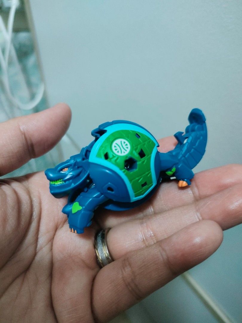 Authentic Bakugan take all 7pcs for 850 (Category: Action & Battle Toys) located in Caloocan City. Submitted by jark_moonshop (Listing ID 1463874753, Image 2). Description: - Collection of Bakugan toys available. - Features multiple characters in both ball and monster forms. - Includes unique colors like gold, purple, and blue. - All toys are transformable. - Some items show minor signs of play. - Ideal for collectors and children's playtime..