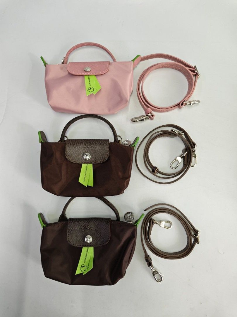 Authentic Longchamp Le Pliage Classic Mini Top Handle Bag with Sling (Category: Luxury Bags & Wallets) located in Quezon City. Submitted by hollowwillow (Listing ID 1463154302, Image 2). Description: New arrival! - Cute Longchamp bags - mini top handle size - Available in multiple colors - can hold an iphone pro max - Lightweight and durable nylon material - Features genuine leather trim and detachable strap.