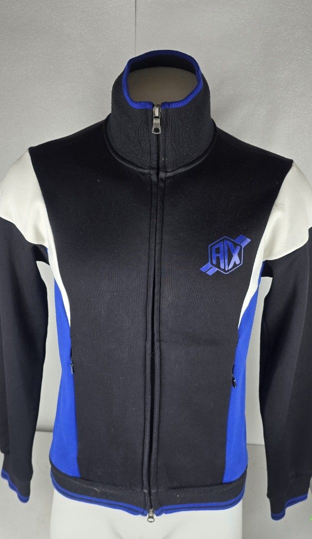 AX Armani Exchange Track Jacket (Category: Coats, Jackets and Outerwear) located in Pasig City. Submitted by dertah (Listing ID 1463754261, Image 1). Description: - Cool AX Armani Exchange track jacket - Color: Black with blue and white panels - Features: Zip-up front, stand-up collar - Branding: AX logo on the chest - Ideal for: Casual wear or sports -Very Classy -Very elegant and sophisticated -Good As New -100% Japan -100% Authentic -LC all yo