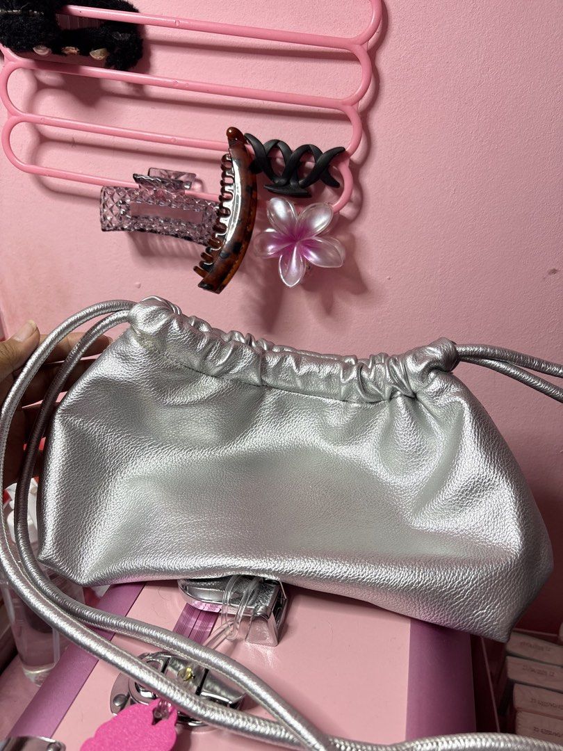 Aztrid Small Dumpling Bag in Silver (Category: Cross-body Bags) located in Manila. Submitted by gian_0 (Listing ID 1463918564, Image 2). Description: used once during the stardust concert, never na nagamit since laging nasa school :(.