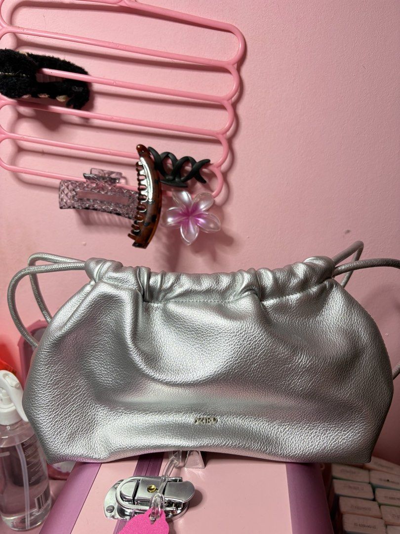 Aztrid Small Dumpling Bag in Silver (Category: Cross-body Bags) located in Manila. Submitted by gian_0 (Listing ID 1463918564, Image 1). Description: used once during the stardust concert, never na nagamit since laging nasa school :(.